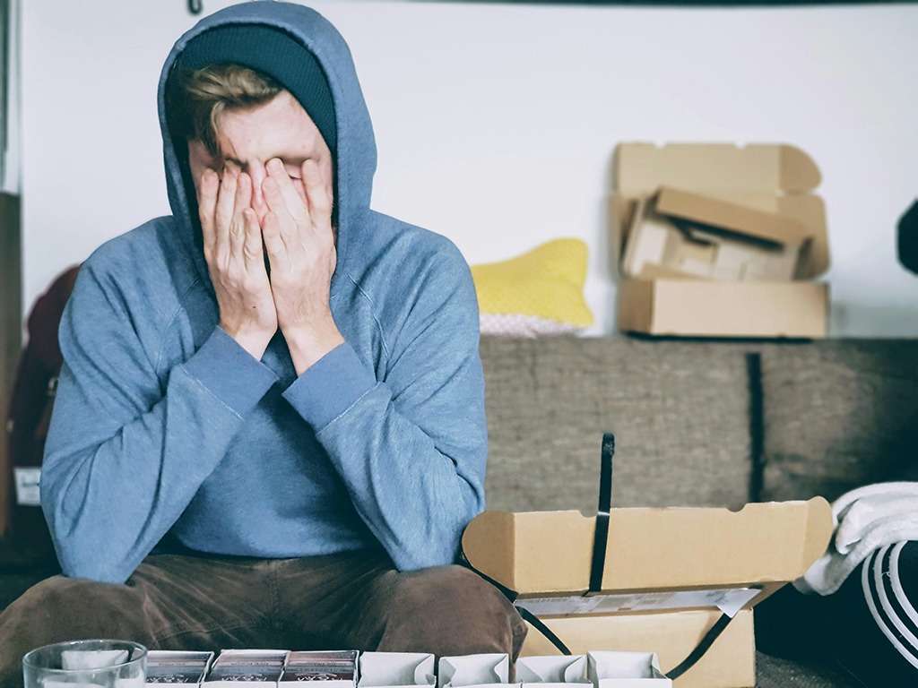 A person looking tired and reflective, examining their own relationship patterns